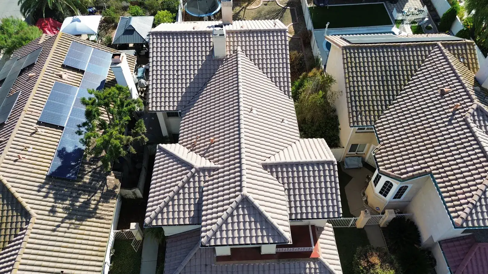 Aerial view of a cleaned tile roof from the supplied Forever Clear project photos