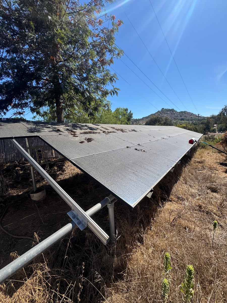 Ground mounted solar panel cleaning and maintenance service