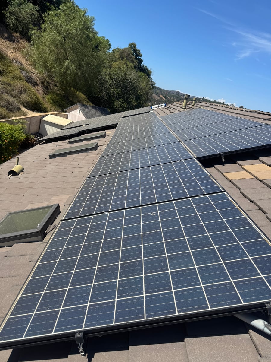 Solar panel and skylight cleaning with roof tile inspection